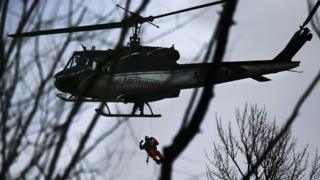 Helicopter assessing damage caused by US mudslide
