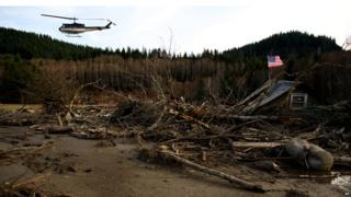Helicopter assessing damage caused by US mudslide