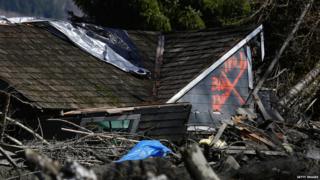 House destroyed in US mudslide marked with paint.