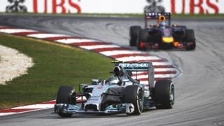 Mercedes Formula One driver Nico Rosberg of Germany drives ahead of Red Bull Formula One driver Sebastian Vettel.