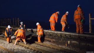 The "orange army" working round the clock to get the line back up and running