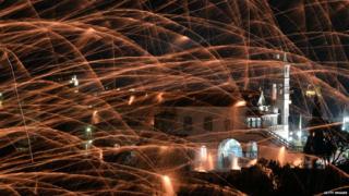 Homemade rockets wizz through the sky during midnight mass on Easter Sunday in the village of Vrontados, on the Greek island of Chios. It's tradition for the two rival churches in the town to perform a "Rocket War"....