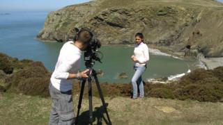 Nel presenting on cliff on Ramsey Island