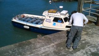 Nel sat on the boat arriving at Ramsey Island