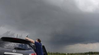 Storm clouds and photographer