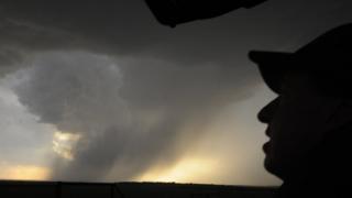 Storm clouds and photographer