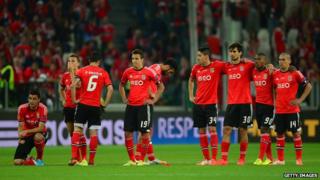 Benfica FC players line up during a penalty shoot-out.