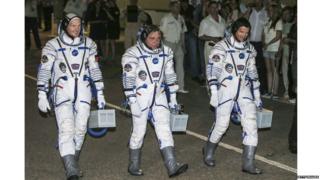 The three space men on board are Commander Maxim Suraev of the Russian Federal Space Agency, Flight Engineer Alexander Gerst of the European Space Agency, and Flight Engineer Reid Wiseman of NASA.