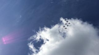 A line of planes fly in formation