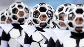 Dancers dressed as footballs