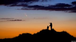 Father and son watching a comet in Massachusetts.