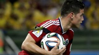 A large insect lands on the arm of Colombia's James Rodriguez
