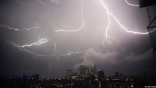Lightning striking Canary Wharf at night
