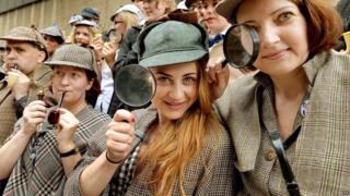 People dressed as Sherlock Holmes character