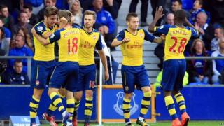 Arsenal's Olivier Giroud celebrates scoring his side's second goal with his team-mates during the Barclays Premier League match at Goodison Park