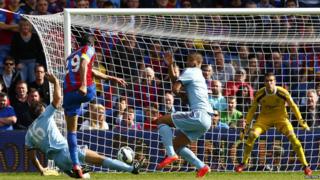 Crystal Palace's Marouane Chamakh (L) scores a goal against West Ham United during their English Premier League soccer match at Selhurst Park in London