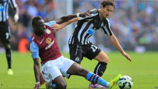 Aston Villa's Aly Cissokho (left) and Newcastle United's Daryl Janmaat battle for the ball during the Barclays Premier League match at Villa Park
