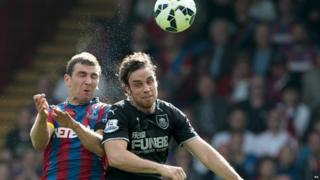 Crystal Palace's James McArthur and Burnley's Michael Duff battle for the ball during the Barclays Premier League match at Selhurst Park