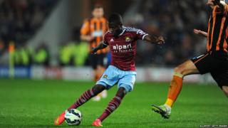 West Ham player Enner Valencia shoots past Michael Dawson of Hull for the first West Ham goal during the Barclays Premier League match between Hull City and West Ham United at KC Stadium