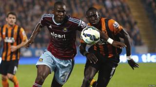 Guy Demel is challenged by Hull City's Mohamed Diame during their English Premier League soccer match at the KC Stadium in Hull