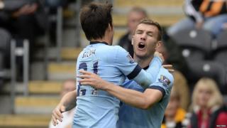 Edin Dzeko and David Silva celebrate