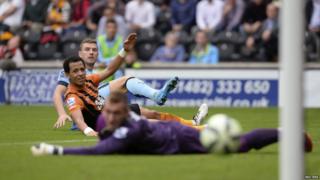 Dzeko watch his second goal go into the net