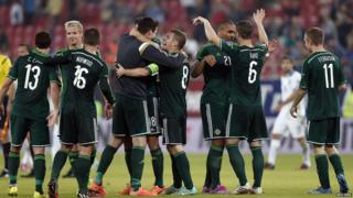 Northern Ireland football team celebrate.