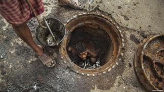 Sewage worker in India