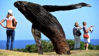 Breaching whale sculpture