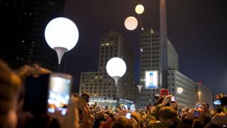 Row of illuminated balloons through Berlin