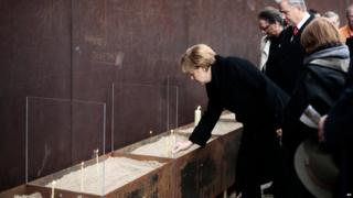 Angela Merkel lights a candle