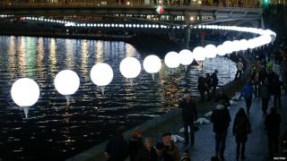 Row of illuminated balloons through Berlin