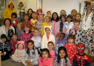 A group of children in onesies