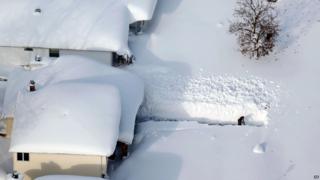 Man digging in snow