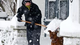 Dog and owner in the snow