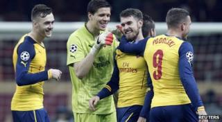 Arsenal players celebrate a goal
