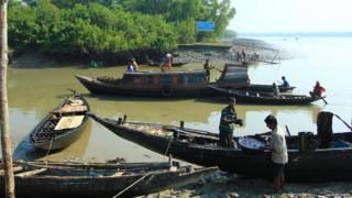 People to collect oil from the river in Sundaban forest