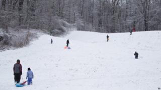 People playing on a the hill in Michigan