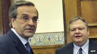 Leader of the New Democracy conservatives, Antonis Samaras (L) meets Pasok leader, Evangelos Venizelos at the Greek Parliament in Athens on May 11, 2012