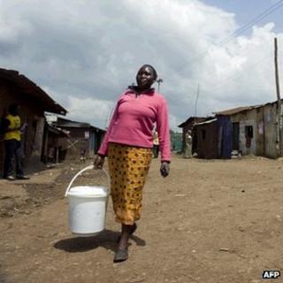 Kenyan woman collecting water