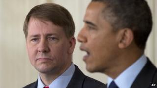Richard Cordray stands left as President Barack Obama announces in the State Dining Room of the White House in Washington, 24 January 2013