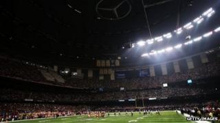 A partial power outage during the third quarter causes a 34-minute delay in the game during Super Bowl XLVII 3 February 2013