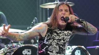 Tim Lambesis singing with his band As I Lay Dying