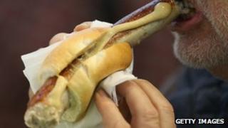 Man eating hot dog