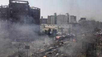 Plumes of smoke rise from the site of a protest in support of deposed Egyptian President Mohammed Morsi during a violent crackdown by Egyptian Security Forces on a pro-Morsi sit-in demonstration at the Rabaa al-Adweya Mosque in the Nasr City, Cairo, Egypt