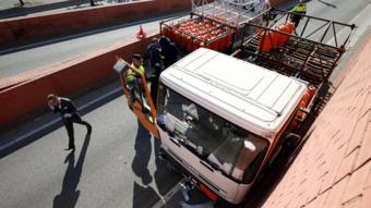 Police at the scene of an incident involving a gas cylinder delivery truck that had been stolen and driven the wrong way along a highway in Barcelona, Spain, 21 February 2017
