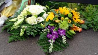 Flowers left by Maguire family