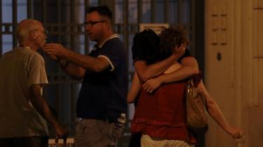 People react in Nice after the lorry hit crowds
