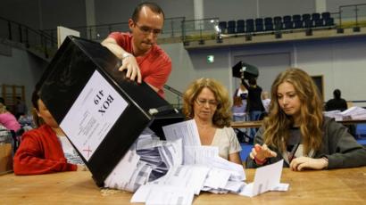 Staff count ballot papers at the Glasgow count centre