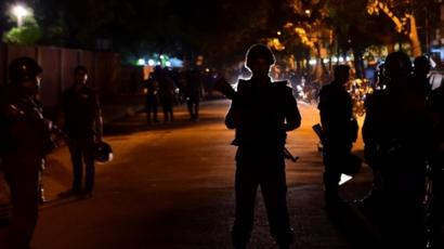 Bangladeshi security personnel stand guard at the Holey Artisan Bakery restaurant in the capital Dhaka